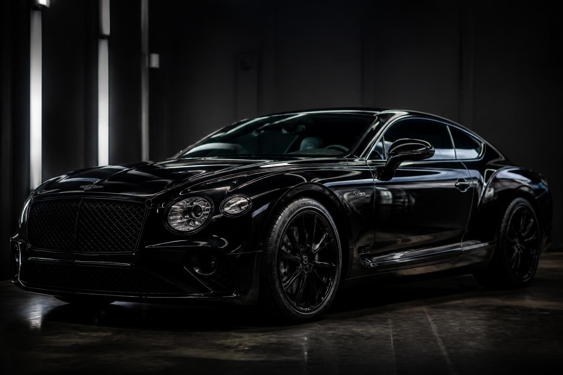 Premium black luxury car in detailing studio